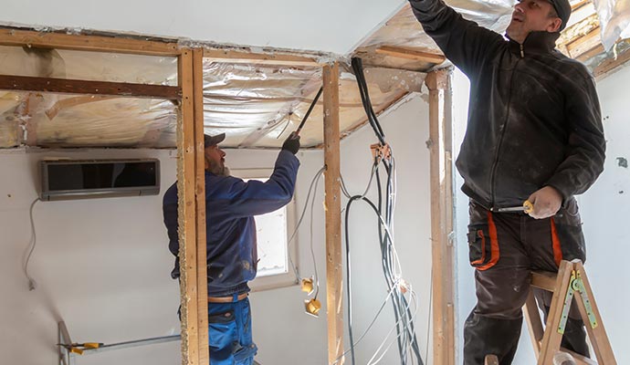 Workers are restoring damaged property