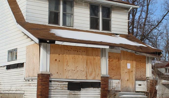 A boarded-up house A boarded-up house