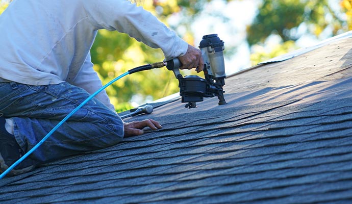 Professional worker replacing roof